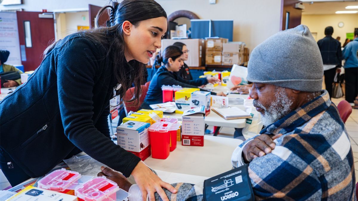 a student interacts with a patient